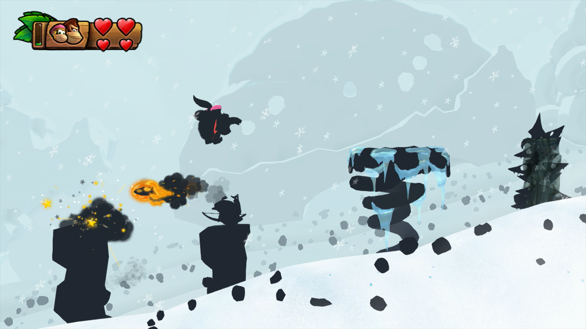 Donkey and Dixiedoing platforming up a snowy mountain, with only shadows of the charaters being visible