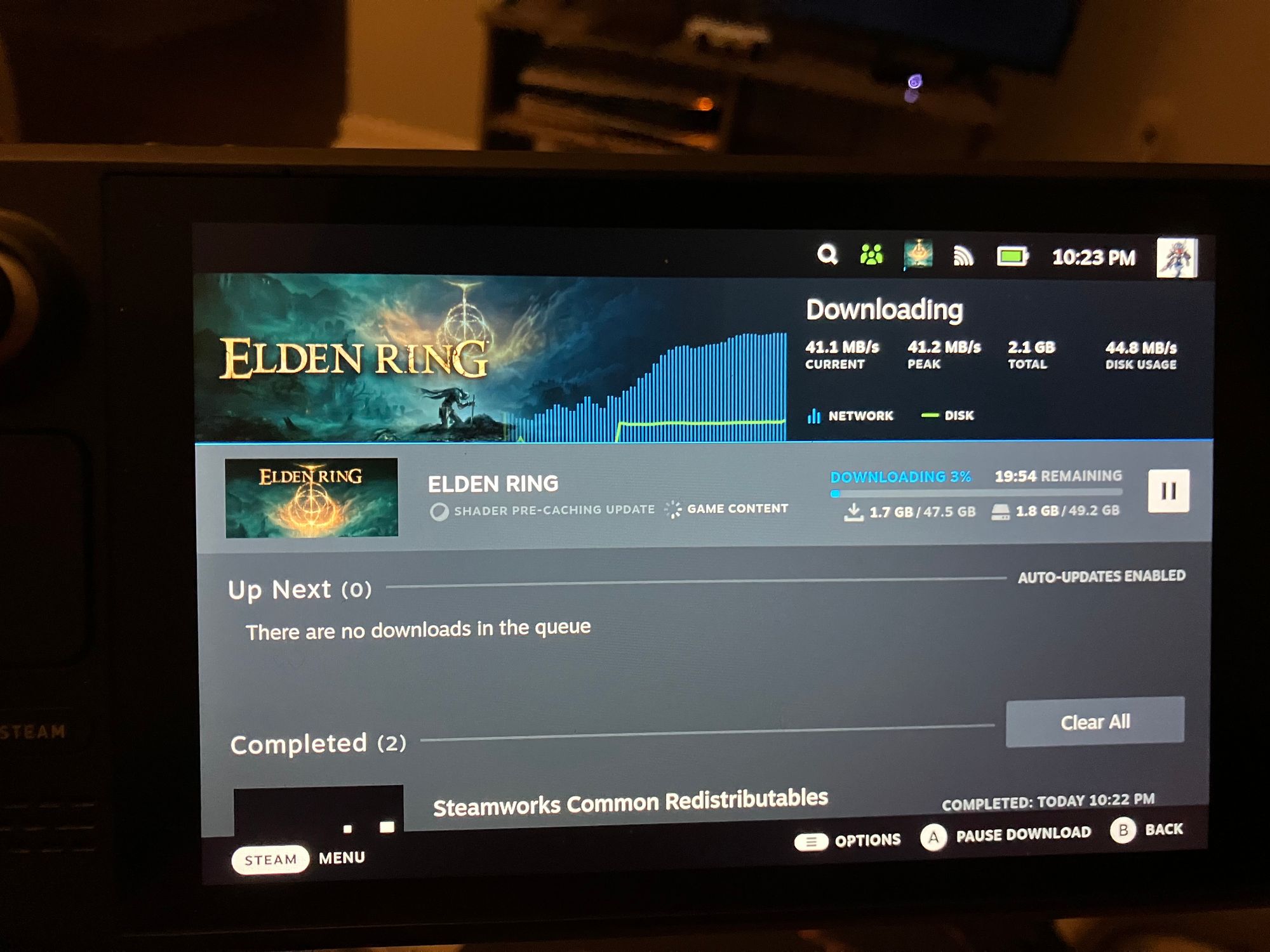 The download screen showing the speeds at which it's downloading Elden ring on Wi-fi. 