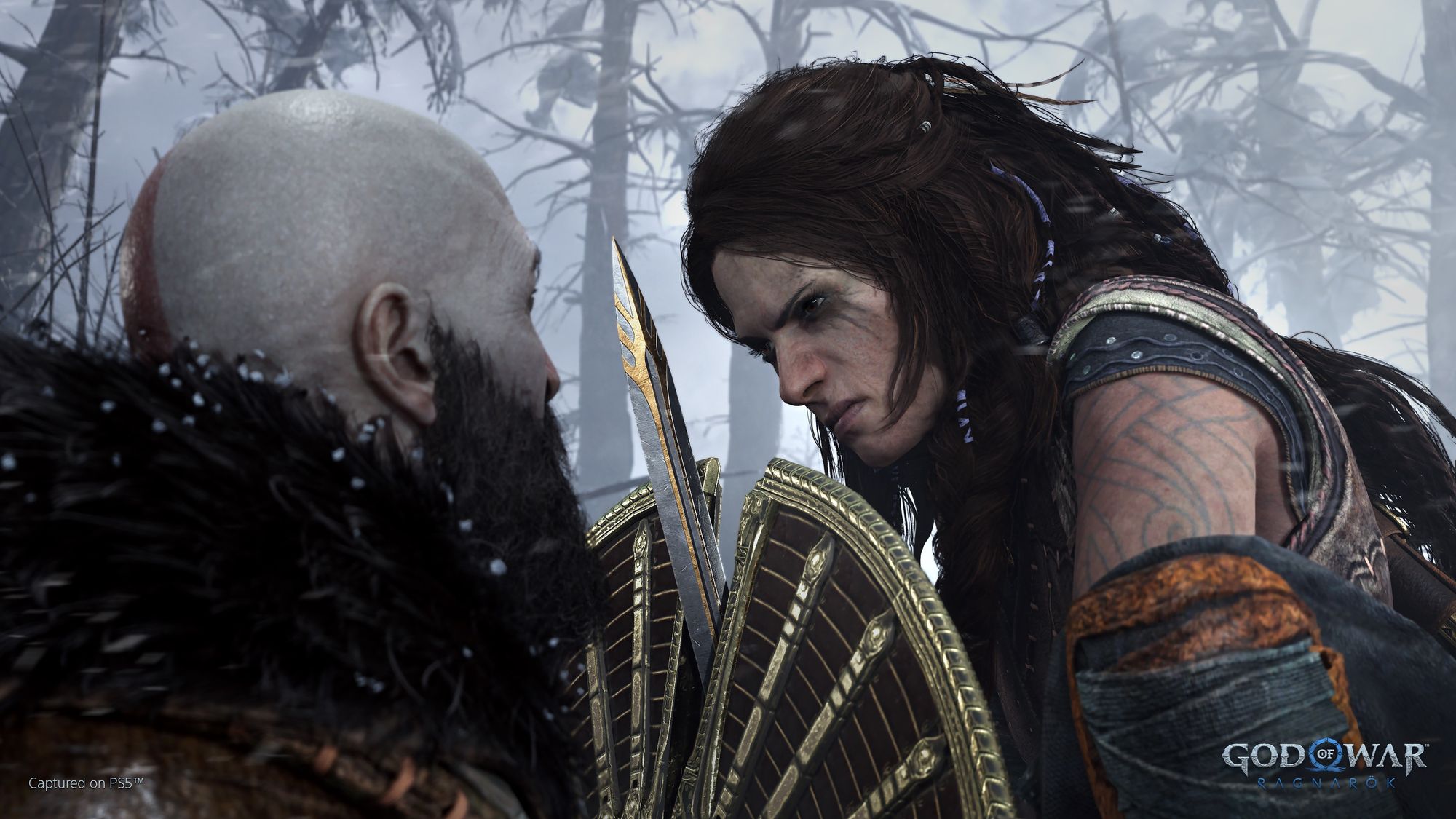 Screenshot of Kratos fending off a vengeful Freya